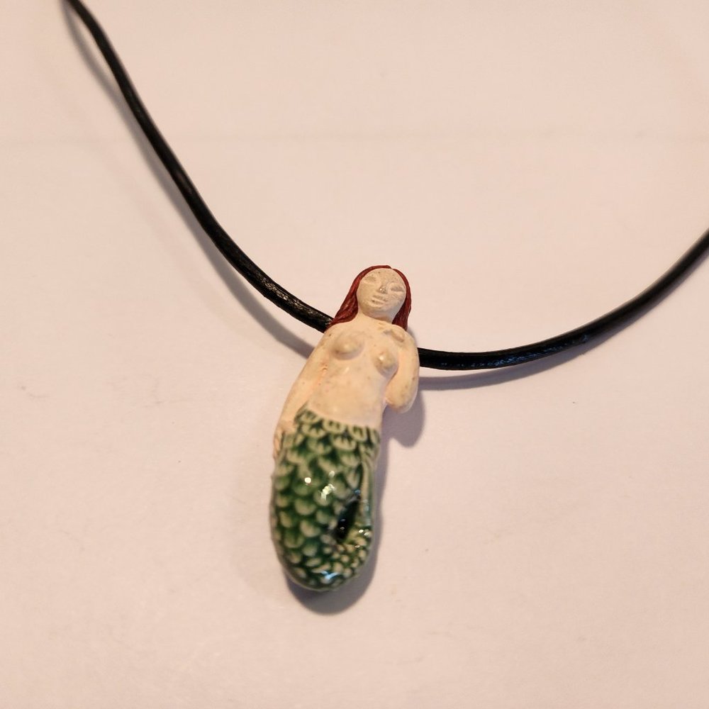 Small Red Headed Pale Skin Mermaid on leather necklace with clasp